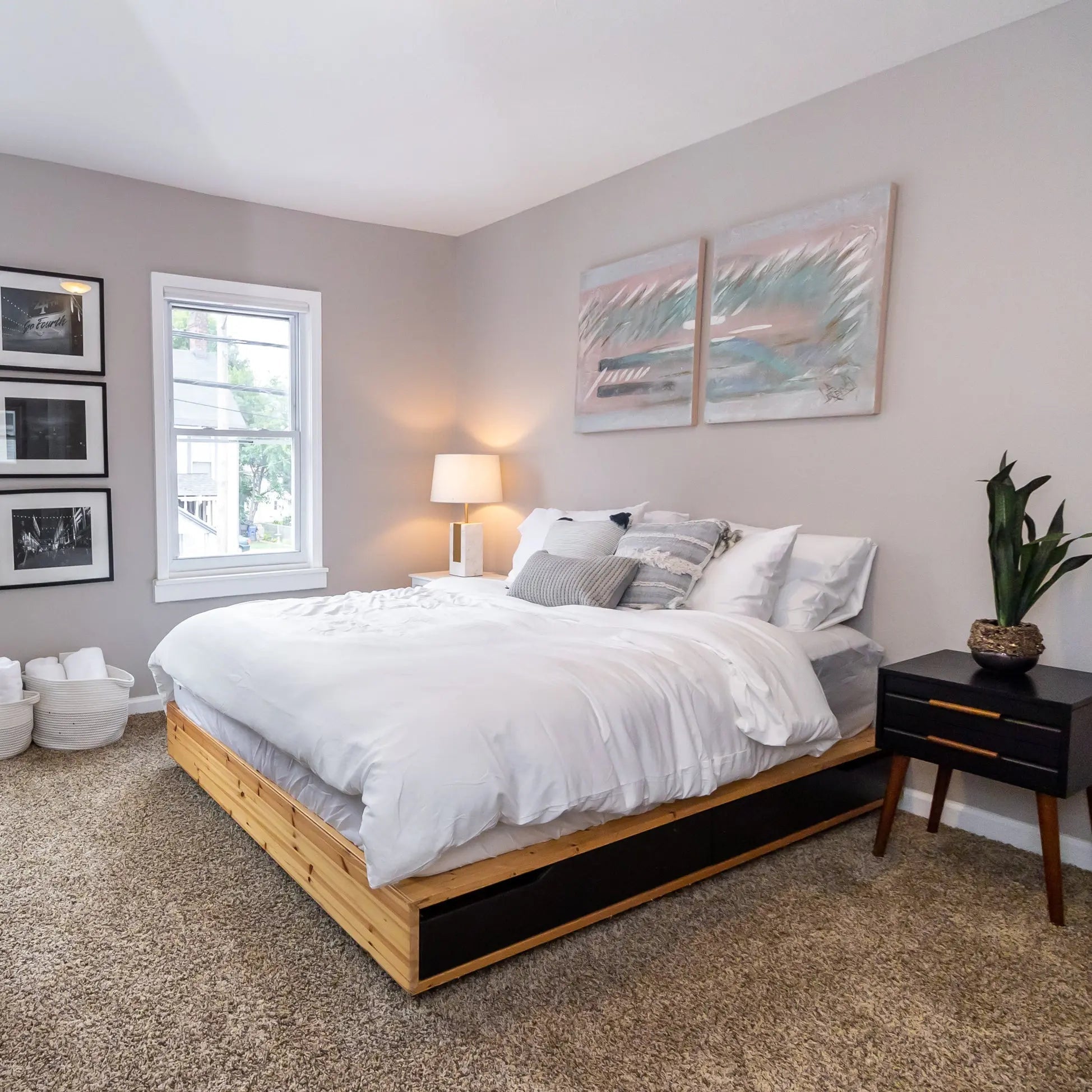 Vacation rental bedding set on styled bedroom bed