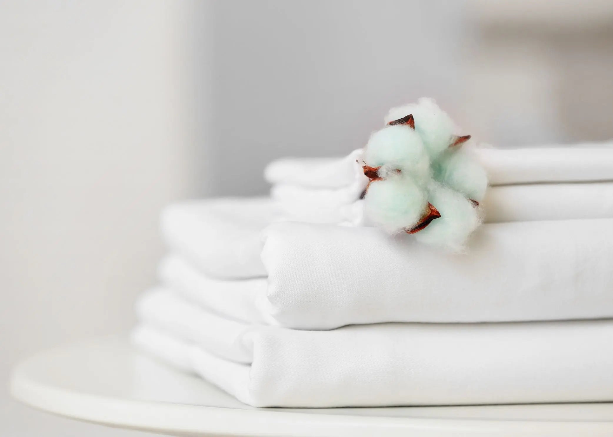 Hotel bedding collection displayed on guest bed