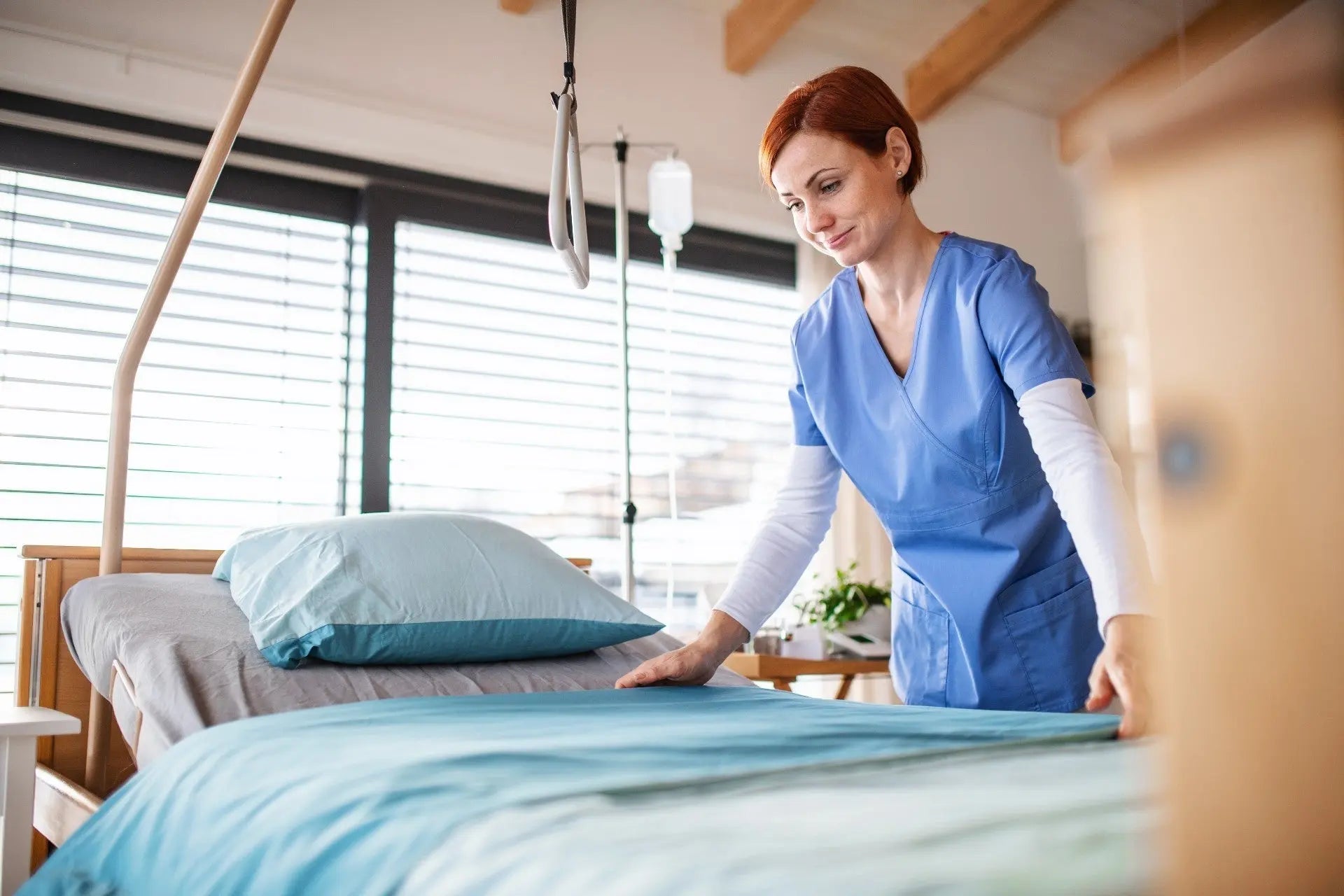 Hospital bed with white sheets and pillow